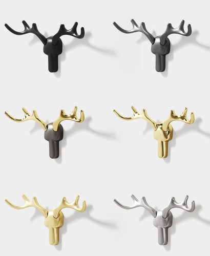 Wandhaken Alberto im modern-skandinavischen Stil, mit solider Konstruktion und einfacher Montage. Farben: Gold, gebürstetes Gold, Schwarz, Grau-Gold, Perlgrau und gebürsteter Nickel – dekorativ und funktional.