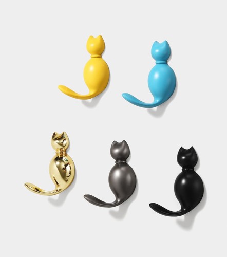 Niedlicher Wandhaken Gatito in Katzenform – ideal für Kinderzimmer und moderne Interieurs. Für Kleidung, Handtücher oder Schlüssel. Farben: Gold, Perlschwarz, Perlgrau, Gelb und Blau.