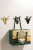 Moderner Wandhaken Adela mit außergewöhnlicher Form. Ideal für Kinderzimmer, Bad, Küche oder Büro. Einfache Montage, Schrauben im Set. Farben: Gold, Perlschwarz, Mattschwarz, Gelb und Blau.